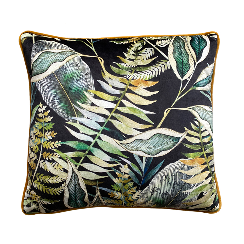 Black and green velvet cushion in tropical botanical print