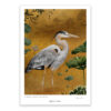 heron bird standing in a golden setting lily pond