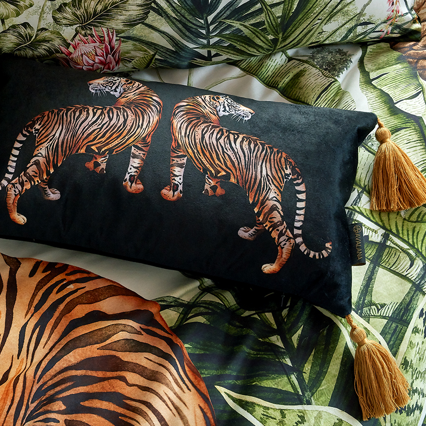 two painted tigers on black velvet cushion