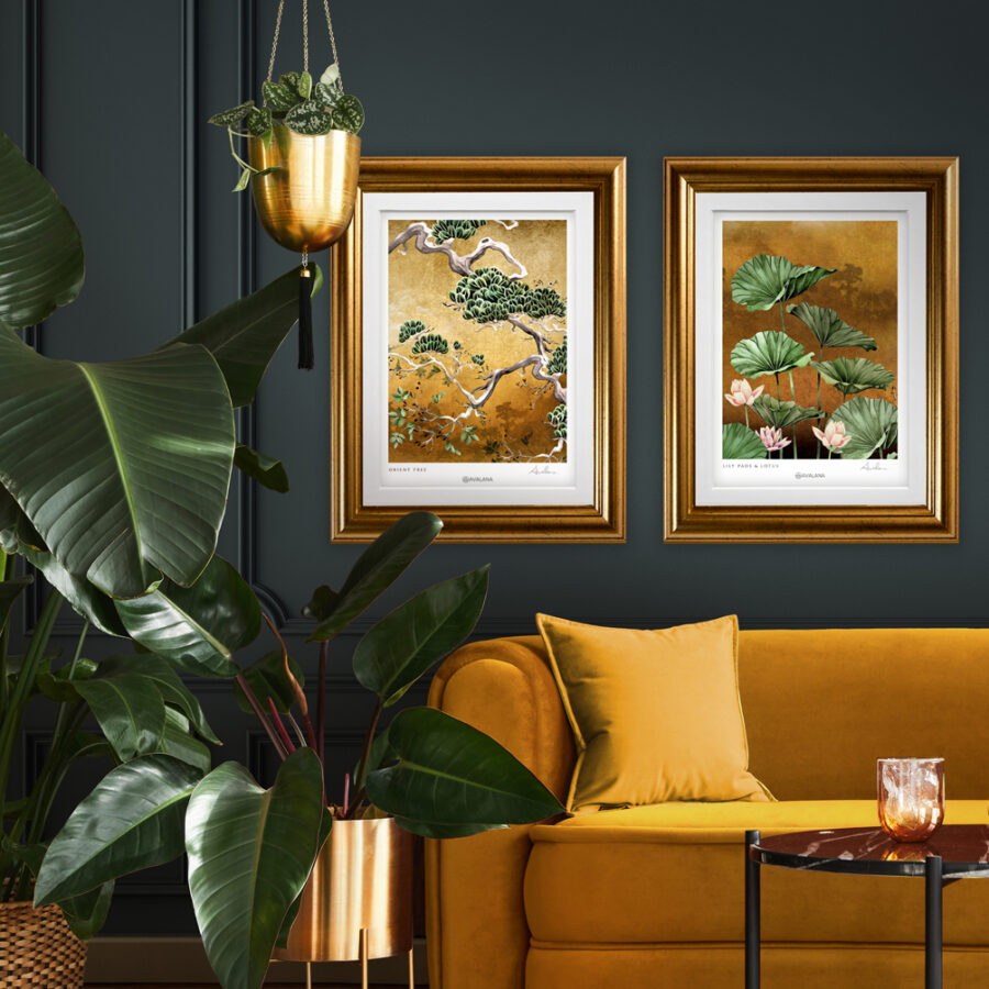 A set of gold and green art prints on the wall in a living room