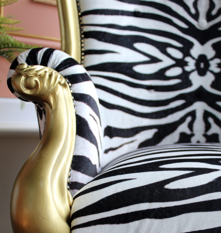 close up of a chair upholstered with the Zebra Mirage velvet fabric