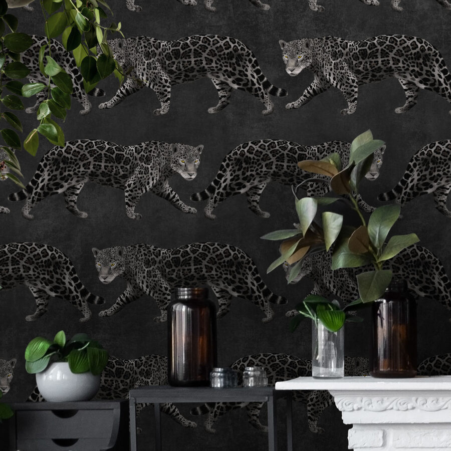 Noir Panthères Wallpaper in a living room by a fireplace with foilage.