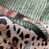 cantaloupe jaguar design on oyster linen fabric
