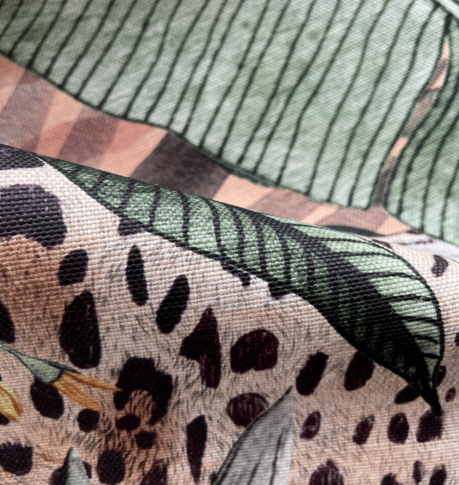 cantaloupe jaguar design on oyster linen fabric