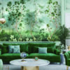 Pastel blues and green woodland wallpaper in a modern living room with coordinating green sofa