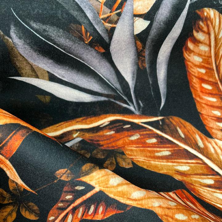 Jungle foliage on velvet in blues and copper orange colours